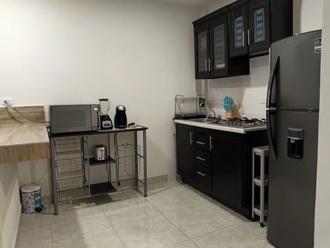 Superior Suite | Private kitchen | Coffee/tea maker, dining tables