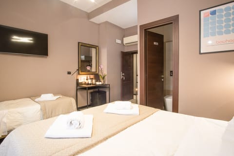 Triple Room | Down comforters, minibar, in-room safe, desk