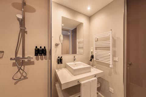 Combined shower/tub, designer toiletries, hair dryer, bathrobes