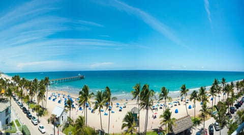 On the beach, white sand, sun loungers, beach umbrellas