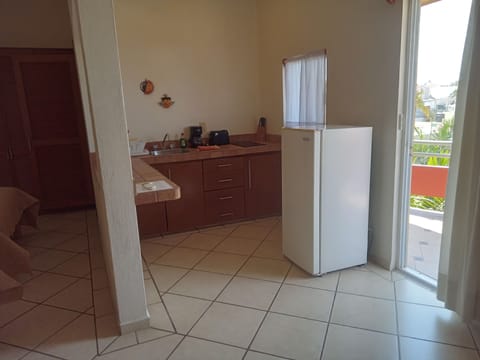 Apartment, 1 Bedroom | Private kitchen | Fridge, stovetop, coffee/tea maker, cookware/dishes/utensils