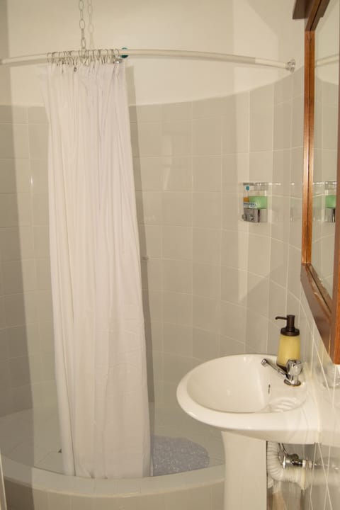 Family Quadruple Room | Bathroom | Shower, hair dryer, towels, soap