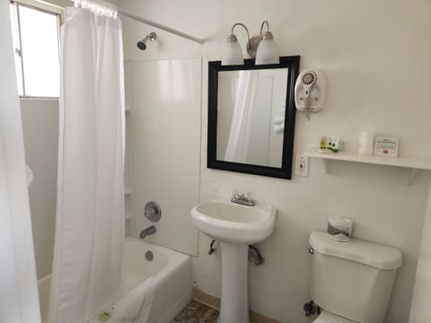 Double Queen | Bathroom | Free toiletries, hair dryer, towels, soap