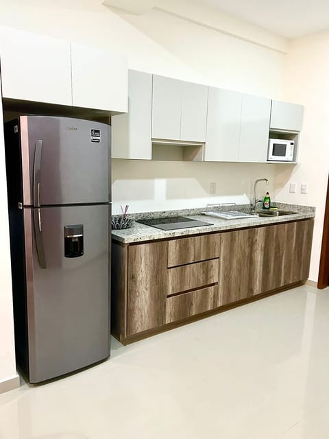 Comfort Apartment | Private kitchen | Full-size fridge, microwave, stovetop, blender