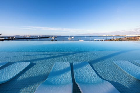 Outdoor pool, pool umbrellas, sun loungers