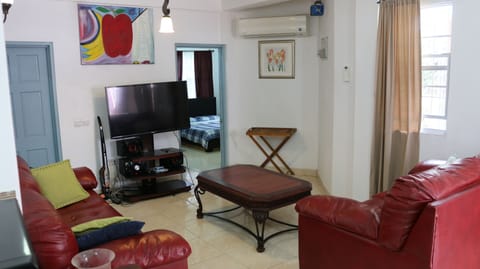 Family Apartment | Living area | 50-inch Smart TV with cable channels, TV