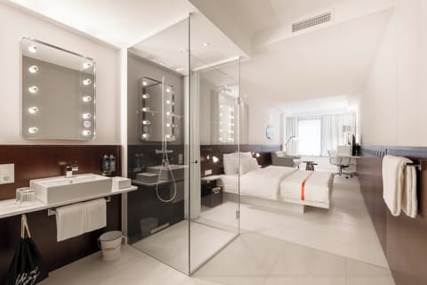 Resident room | Bathroom | Shower, rainfall showerhead, hair dryer, towels