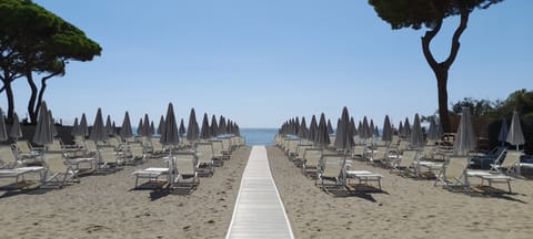 Private beach, white sand, sun loungers, beach umbrellas