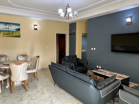 Luxury Apartment | Living area | 50-inch flat-screen TV with cable channels, TV