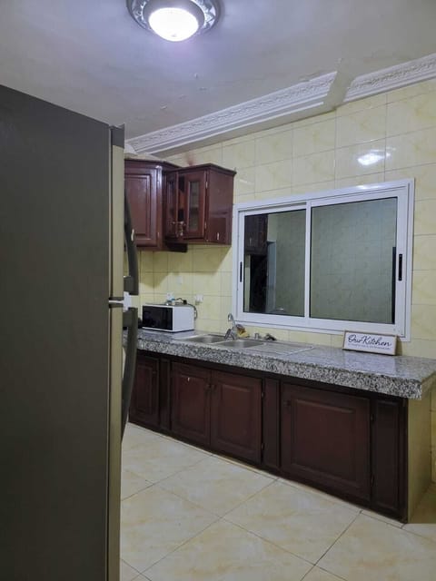 Luxury Apartment | Private kitchen | Full-size fridge, microwave, oven, stovetop