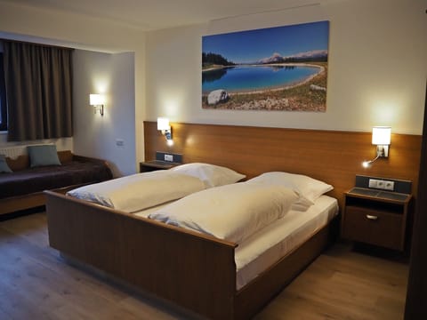 Basic Triple Room | Down comforters, in-room safe, travel crib, free rollaway beds