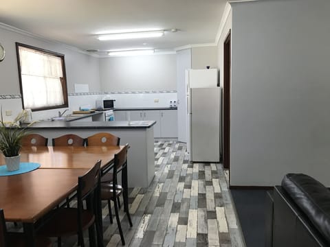 4 Bedroom House (including 1 Queen & 1 Double Bed) | Private kitchen | Full-size fridge, microwave, oven, stovetop