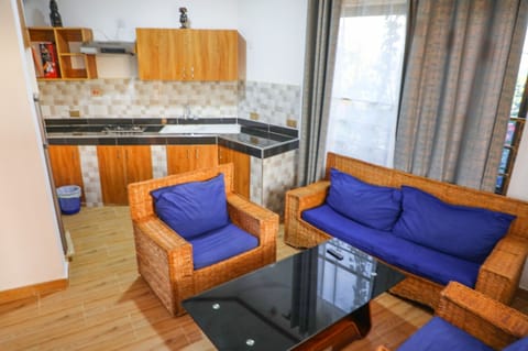 Deluxe Apartment, 2 Bedrooms | Living area | 32-inch flat-screen TV with digital channels, TV