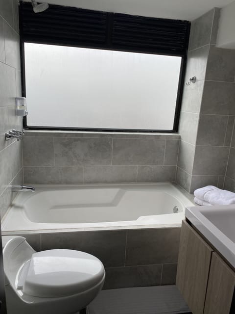 Luxury Room, 1 Queen Bed, Mountain View | Bathroom | Towels, soap, toilet paper