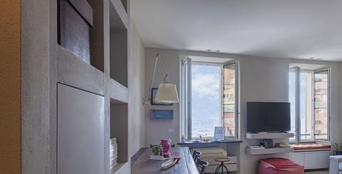 Apartment, 1 Bedroom | Living area | 35-inch flat-screen TV with digital channels, TV