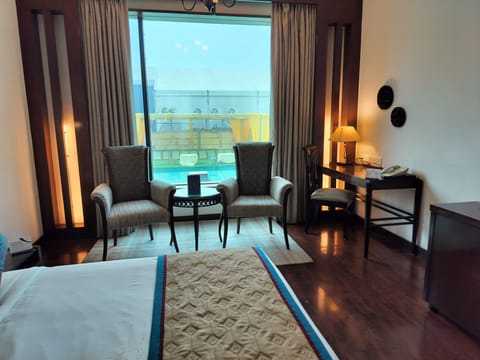 Deluxe Room, Non Smoking, Pool View | In-room safe, desk, laptop workspace, blackout drapes