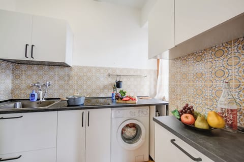 Family Apartment, 2 Bedrooms, Mountainside (Sunrise On The Garda Lake) | Private kitchen | Fridge, microwave, oven, stovetop