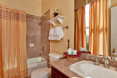 Combined shower/tub, designer toiletries, hair dryer, towels