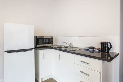 Four Bedroom Apartment | Private kitchenette | Coffee/tea maker, electric kettle