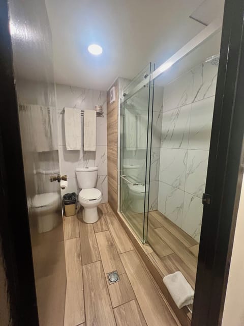 Standard Double Room | Bathroom | Shower, rainfall showerhead, towels, soap