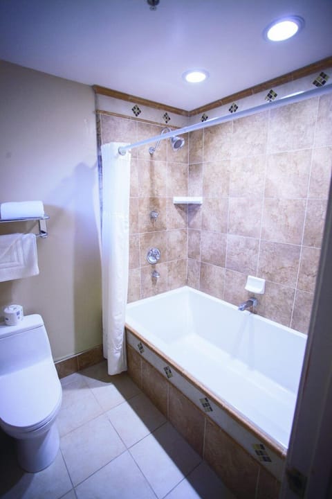 Room, 2 Queen Beds | Bathroom | Shower, hair dryer, towels