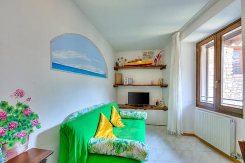 Family Apartment, Multiple Bedrooms, Mountainside (Il Nido dell'Artista) | Living area | TV