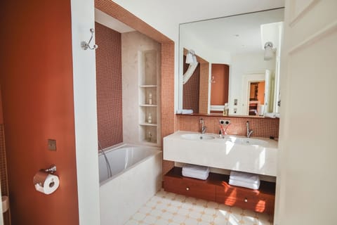 Deluxe Suite | Bathroom | Designer toiletries, hair dryer, towels, soap
