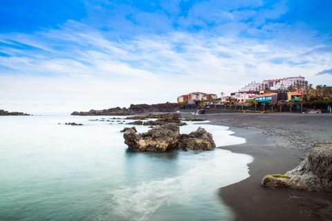 On the beach, black sand, 4 beach bars