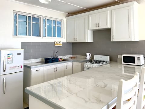 Comfort Suite | Private kitchen | Full-size fridge, microwave, oven, coffee/tea maker