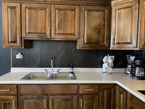 Signature Apartment | Private kitchen | Full-size fridge, microwave, stovetop, coffee/tea maker