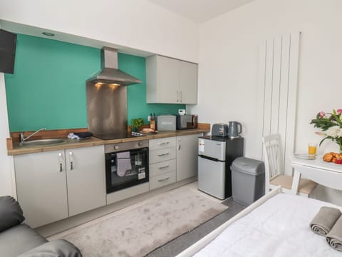 Fridge, electric kettle, toaster, cookware/dishes/utensils