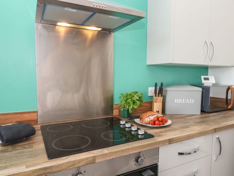 Fridge, electric kettle, toaster, cookware/dishes/utensils