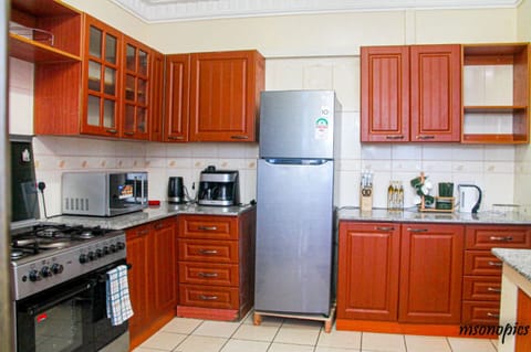 Executive Apartment, 3 Bedrooms | Private kitchen | Fridge, microwave, oven, electric kettle