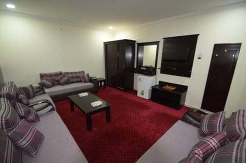 Suite, 1 Bedroom | Living room | 32-inch LCD TV with cable channels, TV