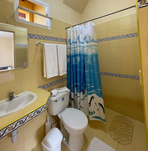 Family Room, Multiple Beds, Private Bathroom, City View | Bathroom | Rainfall showerhead, free toiletries, hair dryer, towels