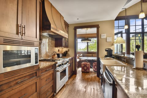 Deluxe Condo | Private kitchen | Full-size fridge, microwave, oven, stovetop