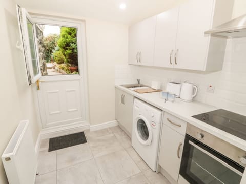 Fridge, electric kettle, toaster, cookware/dishes/utensils