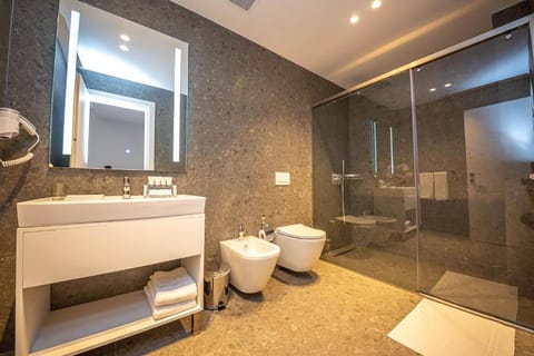 Deluxe Double or Twin Room, Balcony, Partial Sea View | Bathroom | Shower, hair dryer, slippers, towels