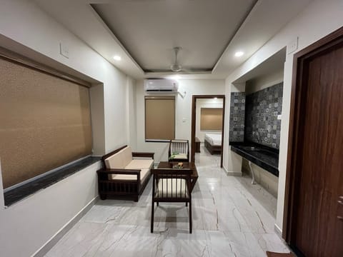 Signature Suite, 1 Bedroom, Private Bathroom | Living area | 43-inch LED TV with satellite channels, TV