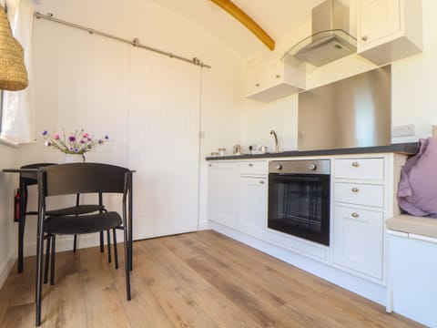 Fridge, electric kettle, cookware/dishes/utensils