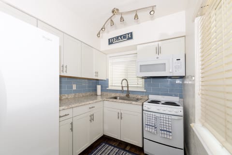 Comfort Apartment | Private kitchen | Full-size fridge, microwave, oven, stovetop