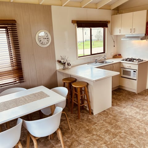 Comfort Cabin, Partial Ocean View | Private kitchen | Full-size fridge, microwave, electric kettle, cookware/dishes/utensils