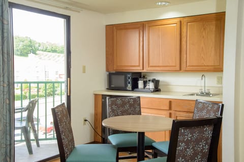 Family Suite, 1 Bedroom | Private kitchen | Fridge, microwave, coffee/tea maker