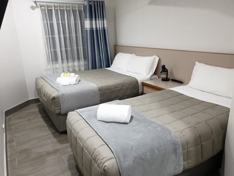 Standard Room, Multiple Beds | Desk, laptop workspace, iron/ironing board, free WiFi