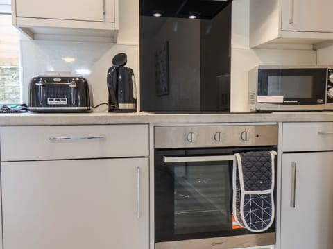 Fridge, electric kettle, toaster, cookware/dishes/utensils