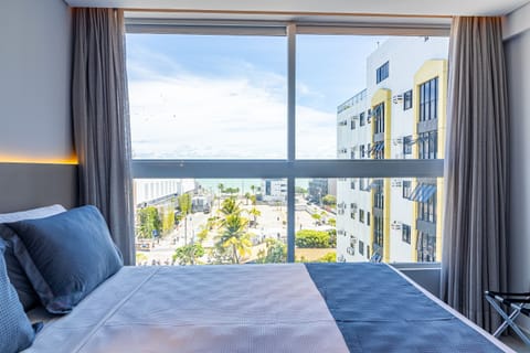 Superior Suite, Ocean View | Minibar, in-room safe, laptop workspace, blackout drapes