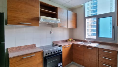 Full-size fridge, highchair, cookware/dishes/utensils, cleaning supplies