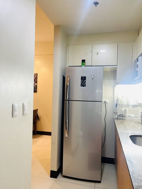 Executive Condo | Private kitchen | Full-size fridge, microwave, oven, stovetop