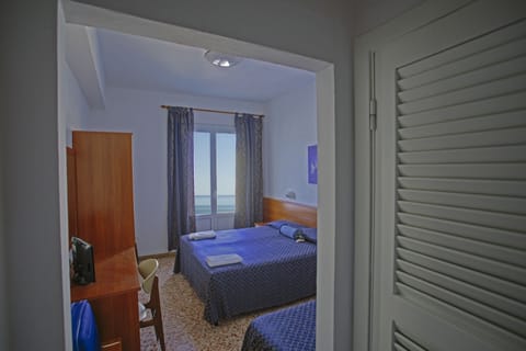 Triple Room, Balcony, Sea View | In-room safe, desk, free cribs/infant beds