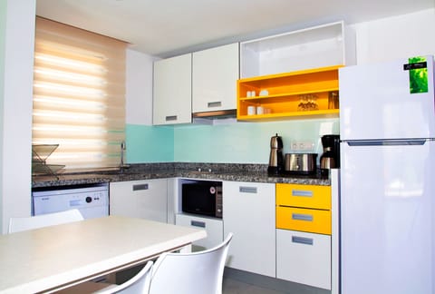 Family Apartment, 2 Bedrooms | Private kitchen | Mini-fridge, stovetop, dishwasher, coffee/tea maker